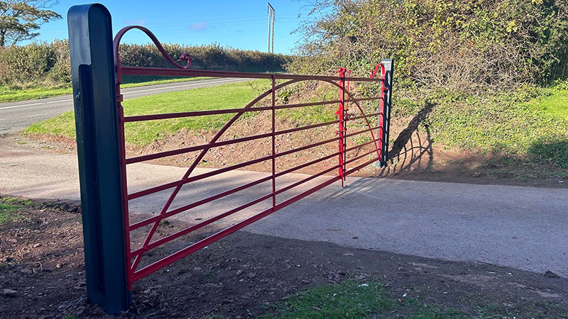 Red forged driveway gate Wales